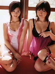 Two alluring gravure idol beauties showing off in their bikini